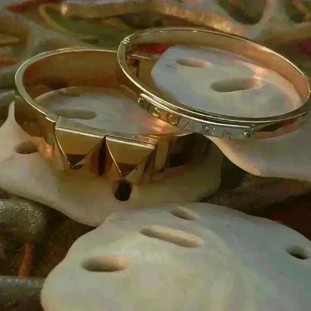 2 beautiful rose gold bangles both clasp on. One Coach and one Michael Kors 💕🌺